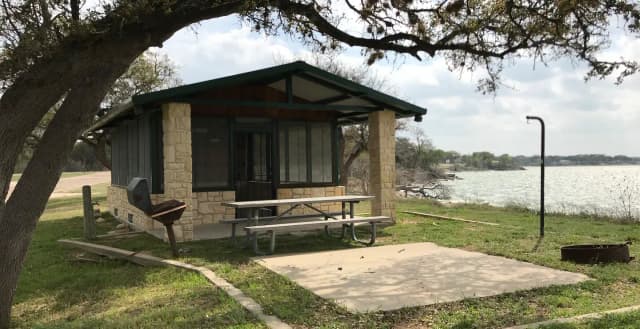 Screen shelter with picnic area, grill, and fire ring