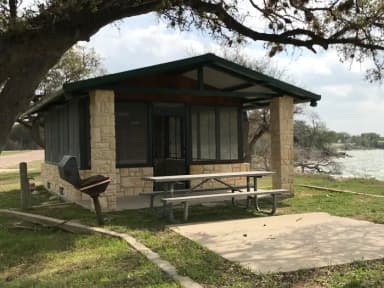 Screen shelter with picnic area, grill, and fire ring