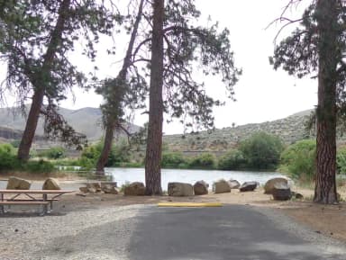 Parking pad, picnic table and fire ring at Big Pines Campsite #1
