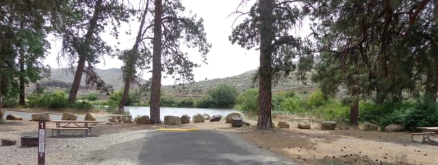 Parking pad, picnic table and fire ring at Big Pines Campsite #1