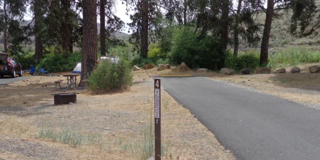 Parking pad, picnic table and fire ring at Big Pines Campsite #4