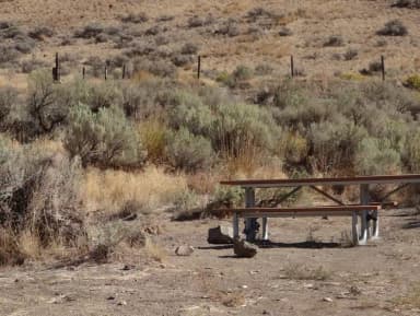 Parking pad and picnic table at Big Pines Campsite #24