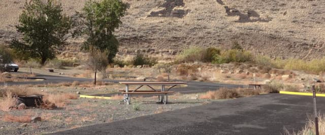 Parking pad, picnic table and fire ring at Big Pines Campsite 26