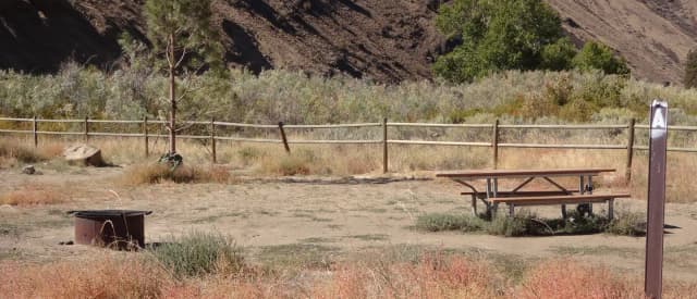 Picnic table and fire ring at Big Pines Walk-in Campsite #A