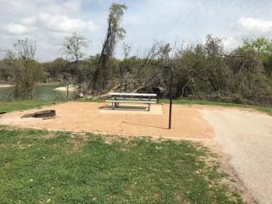 Picnic table, grill, and fire ring located at site