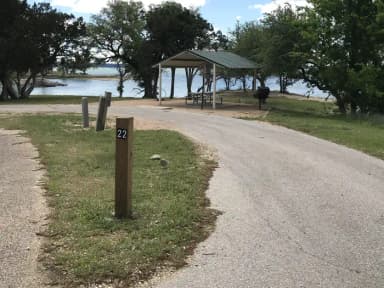 Pull through RV site with grill, fire ring, covered picnic table, and great view of Waco Lake
