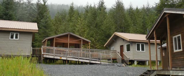 Deep Bay Cabin Four buildings with accessible walkway and gravel driveway
