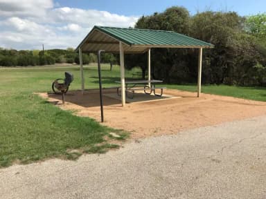 Covered picnic table, grill, and fire ring