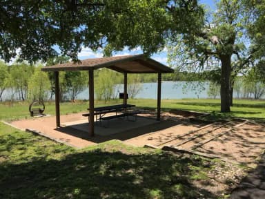 Covered picnic table, grill, and fire ring with great view of Waco Lake