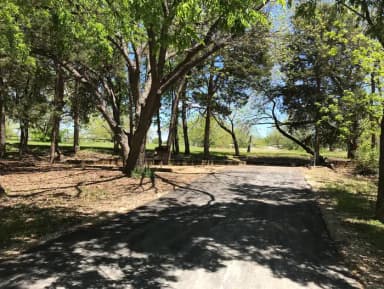 RV site with picnic table, grill, and fire ring