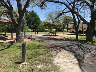 Pull through RV site with covered picnic table, grill, and fire ring