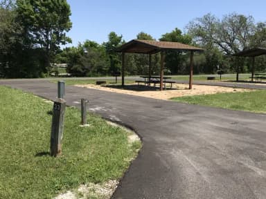 Pull through RV site with covered picnic table, grill, and fire ring