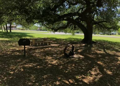 Tent site with picnic table, grill, and fire ring