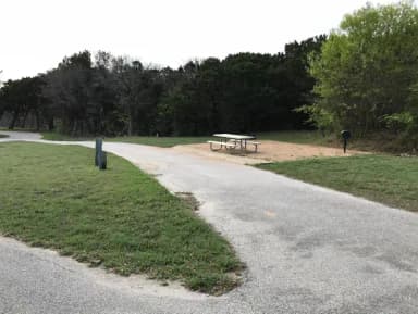 Pull through RV site with grill, fire ring, and picnic table