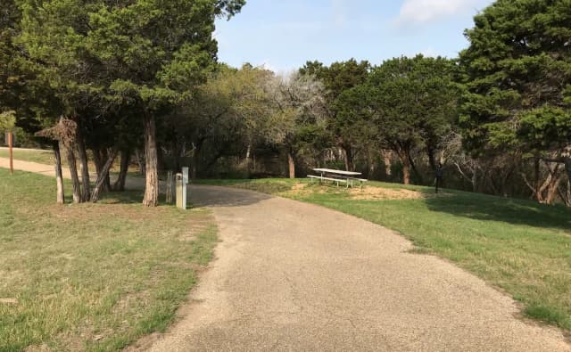 Pull through RV site with grill, fire ring, and picnic table