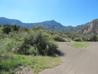 Parking site, a tight pull through with green mountains in the background