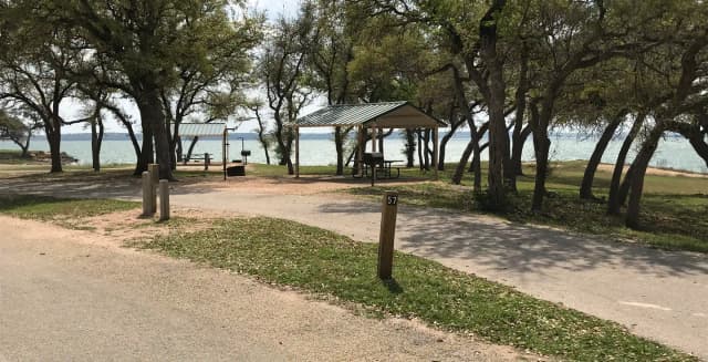Pull through RV site with grill, fire ring, covered picnic table, and great view of Waco Lake