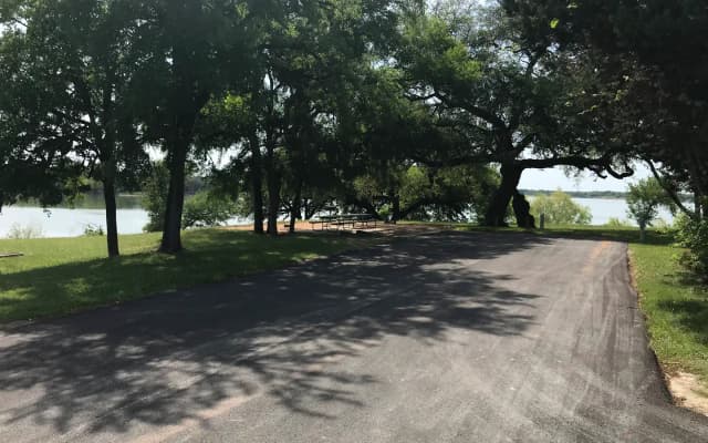 Double RV site with picnic tables, grill, and fire ring