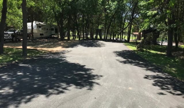 Double RV site with picnic tables, grill, and fire ring