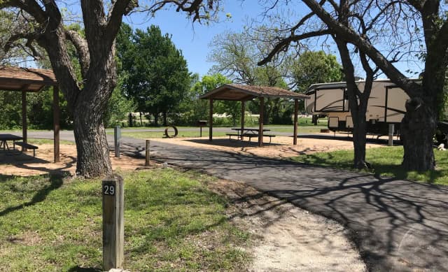 Pull through RV site with covered picnic table, grill, and fire ring