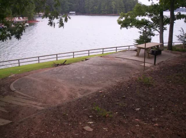 Long flat site, picnic table.