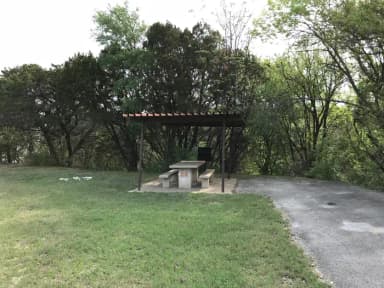 RV site with covered picnic table and grill