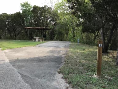 RV site with covered picnic table and grill