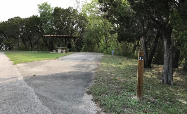RV site with covered picnic table and grill