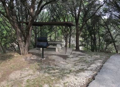 RV site with covered picnic table and grill