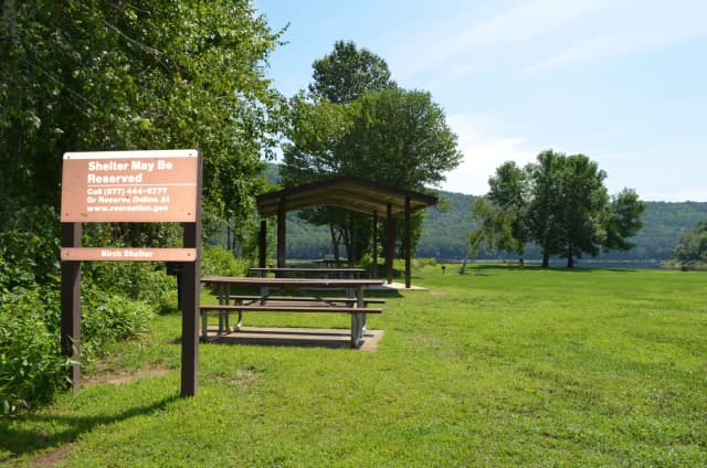 Birch Shelter at Surry Mountain Lake Beach, with lake and Surry Mountain in the background