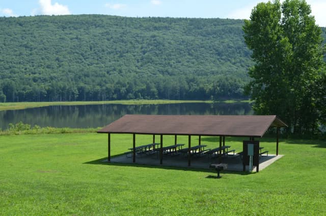 Aspen Shelter at Surry Mountain Lake Beach with the lake and the mountain in the background