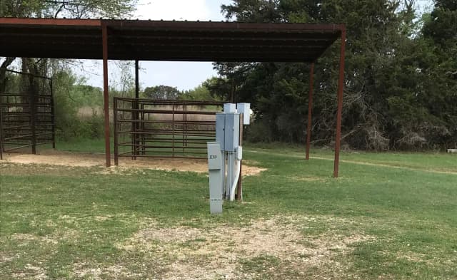 Equestrian site hookup with two stalls and restroom/shower facility nearby
