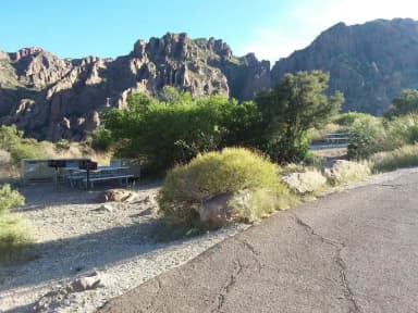 Campsite image with picnic tables, bear box and tent area