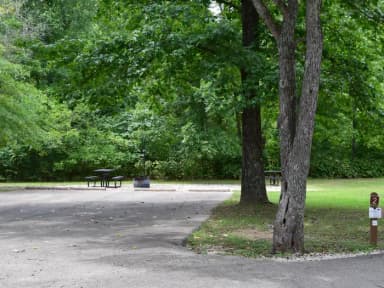 Campsite 2 showing double wide parking spur, picnic tables, lantern post and fire ring