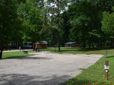 Double Campsite 6 showing double wide parking, picnic tables, lantern post and fire ring