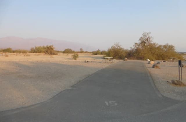 Furnace Creek Campground Standard Non-electric Site #15 with picnic table, fire ring, and paved parking pad.