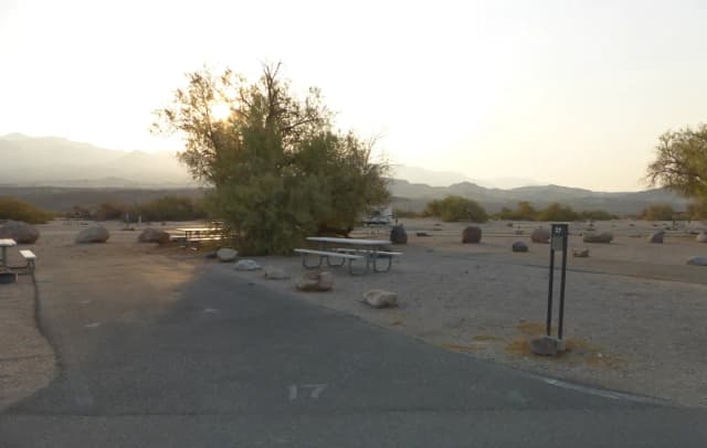 Furnace Creek Campground standard nonelectric site #17 with picnic table and fire ring.