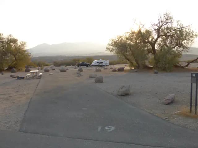 Furnace Creek Campground standard nonelectric site #19 with picnic table and fire ring.