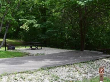 Campsite 19 showing parking spur, picnic table, lantern post and fire ring