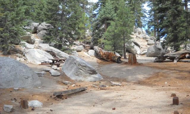 Boulder Basin campsite 3 with picnic table and fire ring.