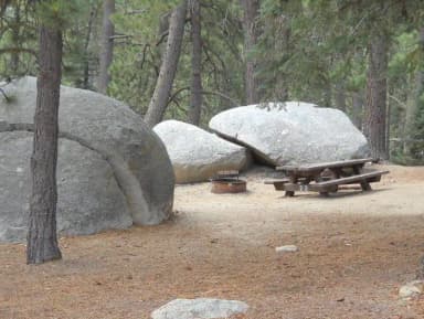 Boulder Basin campsite 23 with picnic table and fire pit.