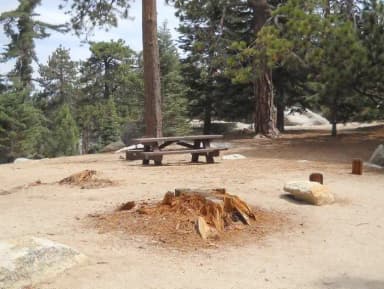 Boulder Basin campsite 27 with picnic table and fire pit.