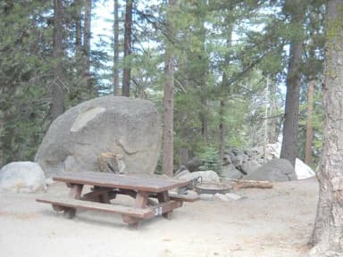 Boulder Basin campsite 30 with picnic table and fire pit.