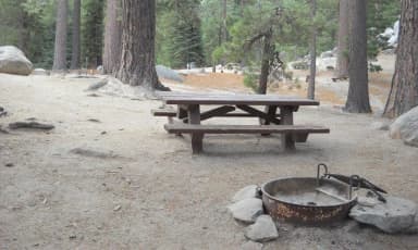 Boulder Basin campsite 30 with picnic table and fire pit.