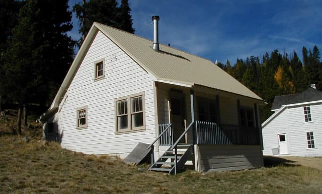White house with clapboard siding.