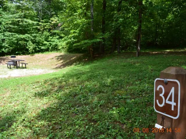 Campsite 34 showing number post, picnic table and fire ring