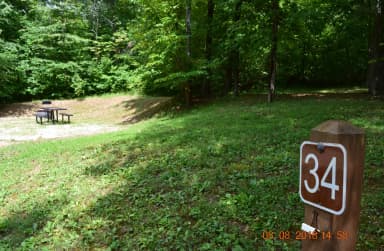 Campsite 34 showing number post, picnic table and fire ring