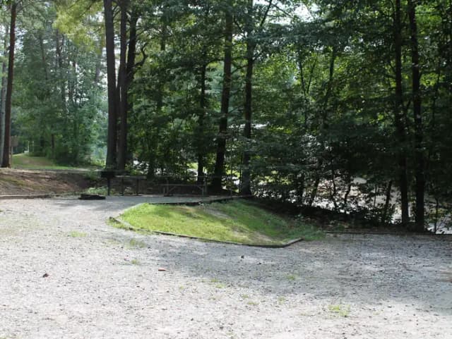 Gravel site with table, fire pit, grill