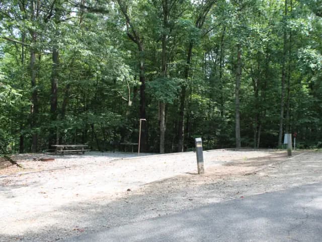 Gravel site with table, fire pit, grill