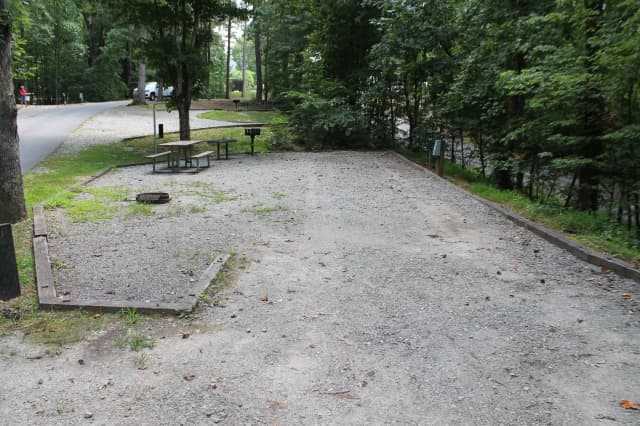 Gravel site with table, fire pit, grill